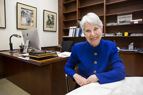 photo of Chancellor Christ sitting at desk